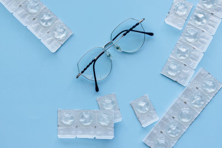 Black Framed Eyeglasses on Blue Table